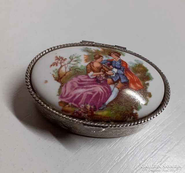 Old silver-colored chiseled small tin box with a porcelain scene insert on the top