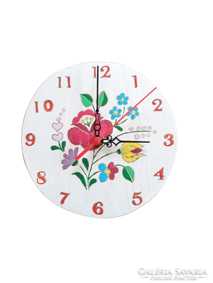 White wooden wall clock with Kalocsa pattern.