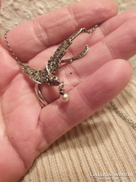 Silver necklaces with a beautiful bird