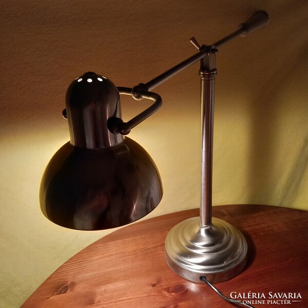 Chrome, tiltable, table or workshop lamp. It works.