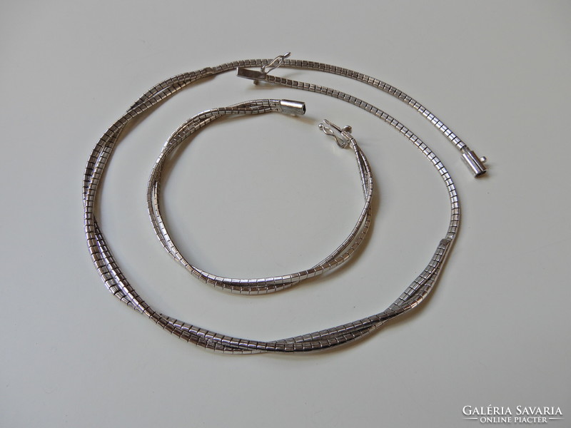 Old braided silver jewelry set with safety lock