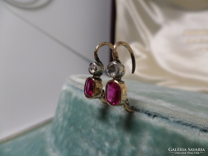 A pair of antique gold earrings with synthetic rubies and diamonds
