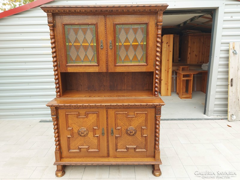 The colonial sideboard shown in the pictures is for sale.