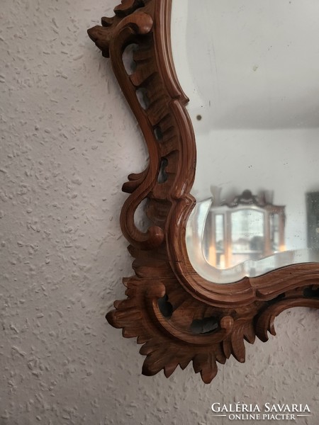 Unique wall mirror carved from yew wood, with bracket