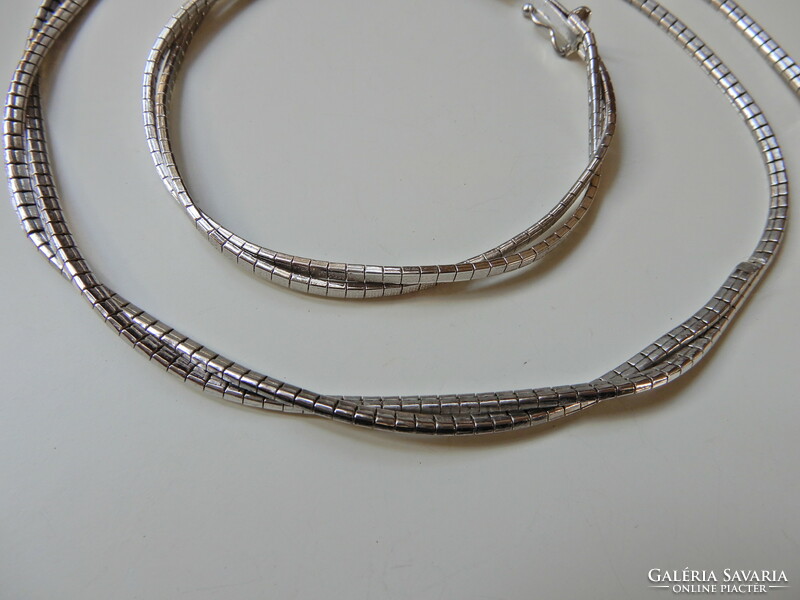 Old braided silver jewelry set with safety lock