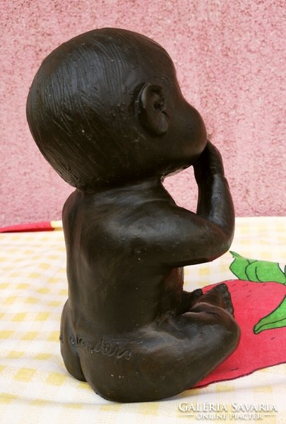 A modern sculptural work of art. Bronze coated ceramic sculpture. Infant