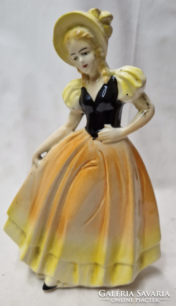 Porcelain figurine of a girl in a yellow dress in perfect condition 17.5 Cm.