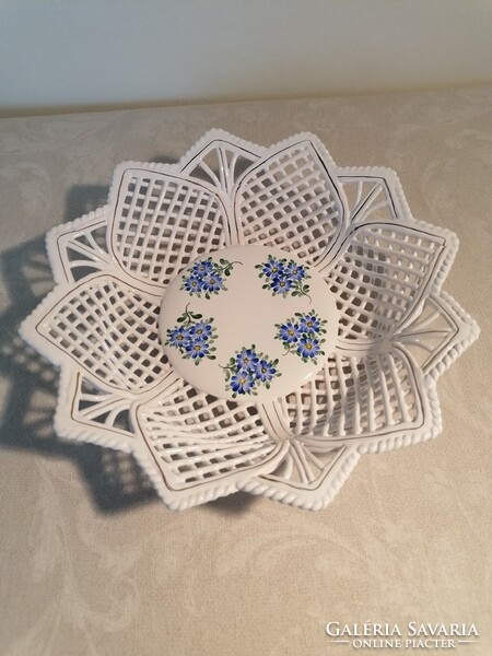 White openwork serving bowl with a laced edge, with a blue flower pattern