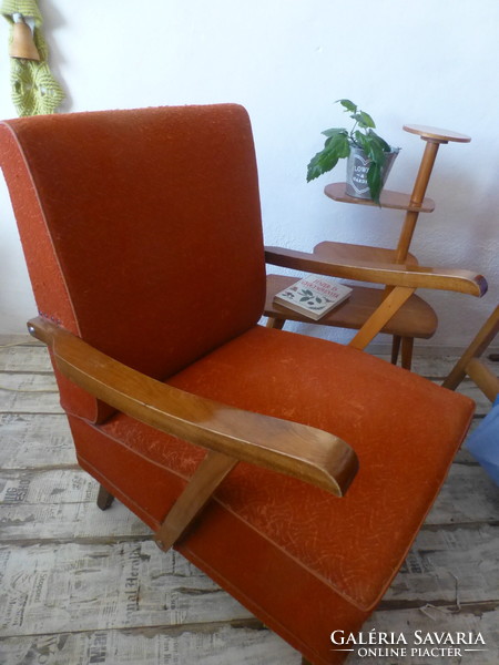 Scandinavian-style red retro armchair with bent arms