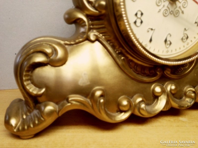 Baroque-style battery-operated table clock in a gold-plated vinyl housing, accurate and functional