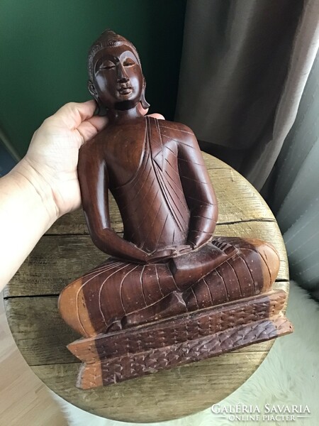 Hand carved wooden Buddha statue