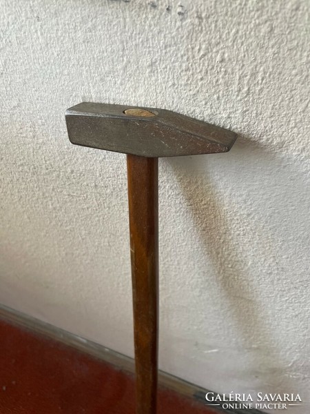 Old hammer with extra long handle