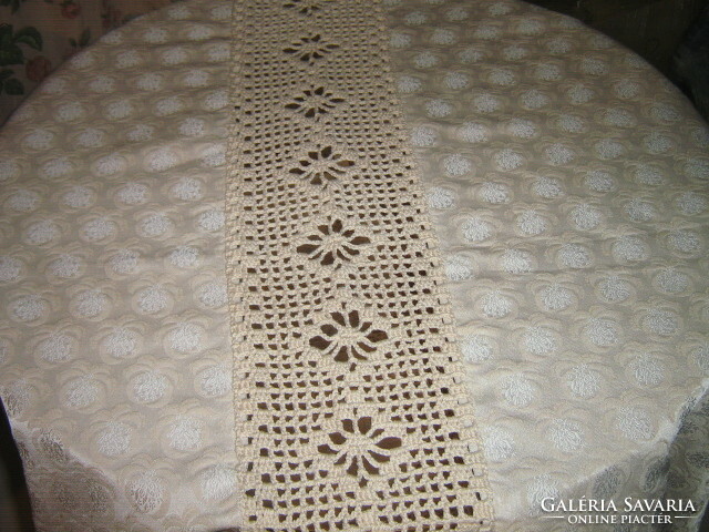 Elegant oval silk woven damask tablecloth decorated with beautiful crocheted lace
