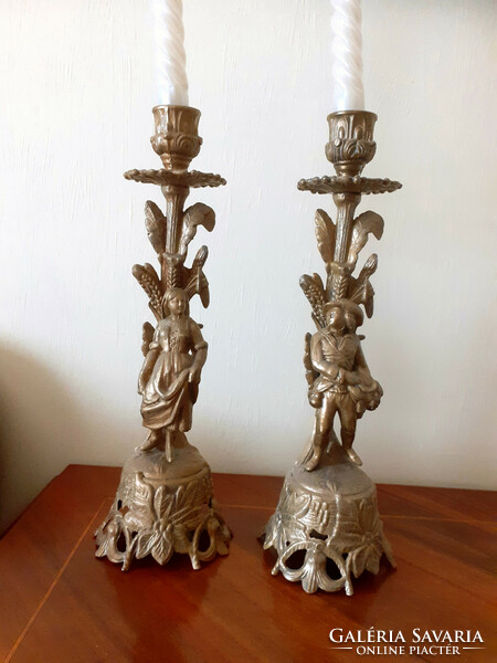 Pair of female and male shaped candle holders. 27 cm