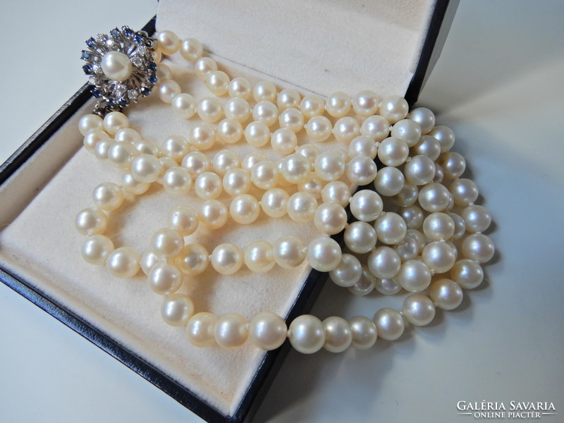 Two rows of genuine Akoya pearls with white gold clasp, sapphire stones and diamonds