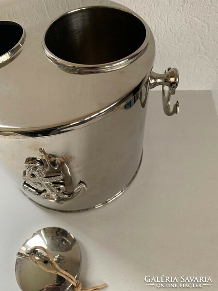 Nautical yacht equipment - a bottle of wine or an ice bucket for a champagne cooler with an anchor decoration
