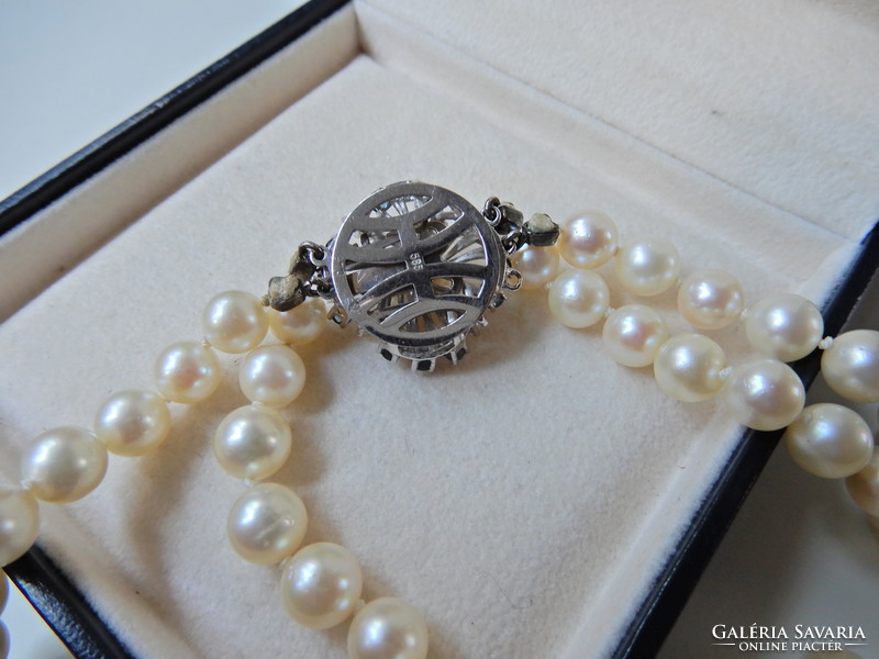 Two rows of genuine Akoya pearls with white gold clasp, sapphire stones and diamonds