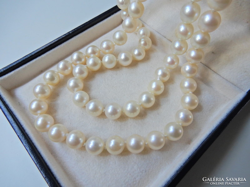 Two rows of genuine Akoya pearls with white gold clasp, sapphire stones and diamonds