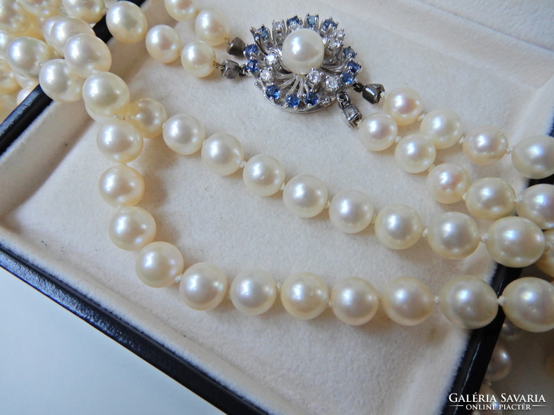 Two rows of genuine Akoya pearls with white gold clasp, sapphire stones and diamonds