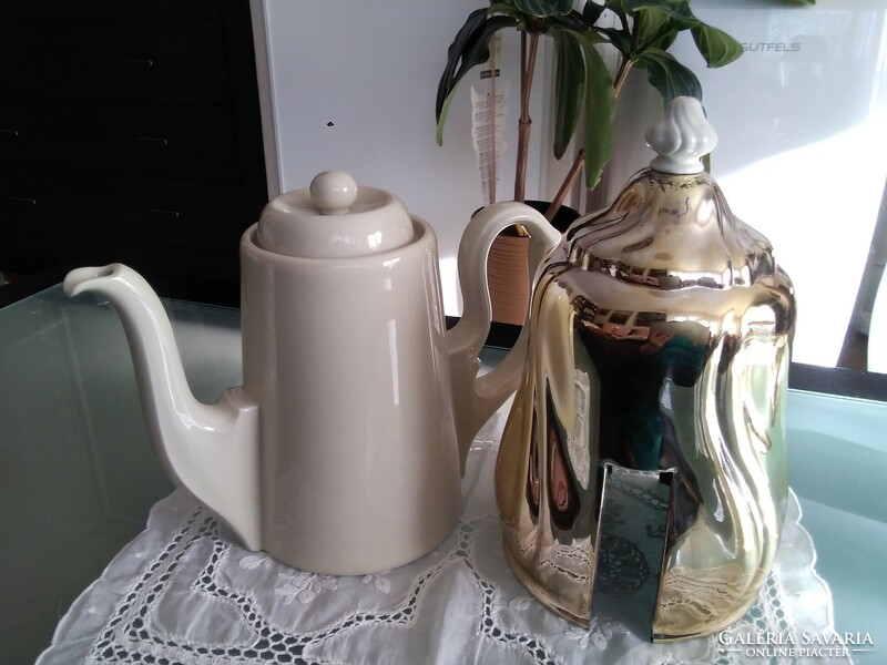 Large porcelain warming tea and coffee pot covered with a chrome-plated thermo jacket.