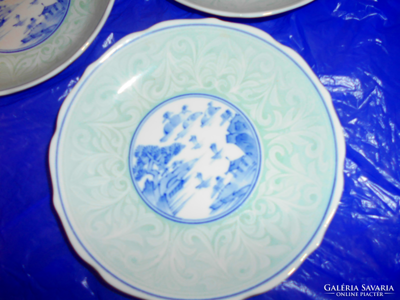 3 Celadon glazed hand-painted porcelain plates with an oriental pattern