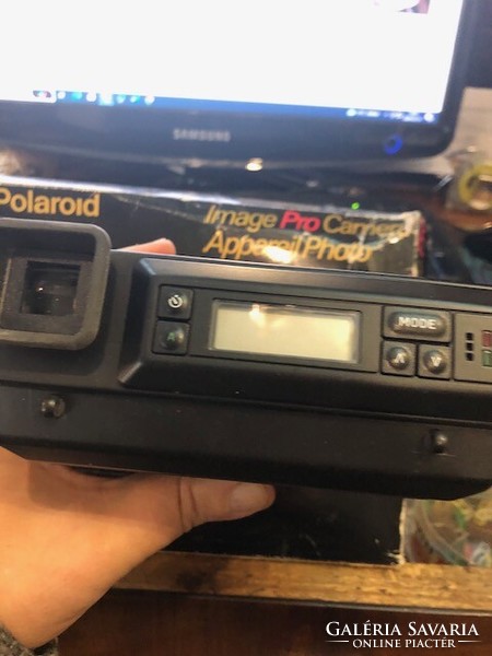 Polaroid image pro camera in original box with book.