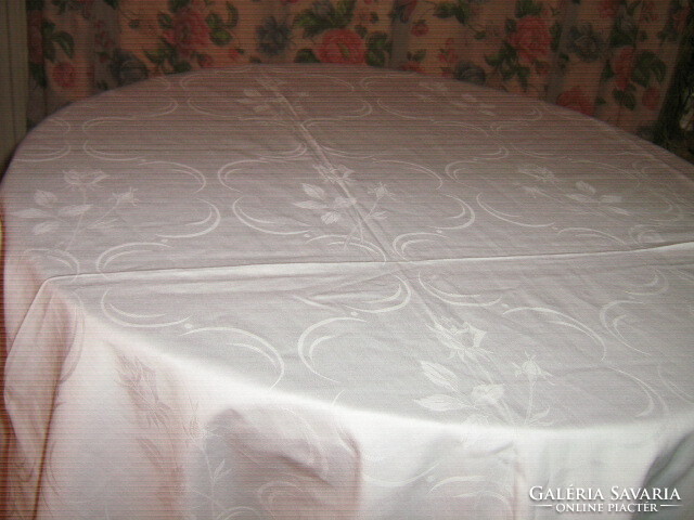 Beautiful white damask tablecloth with baroque rose pattern