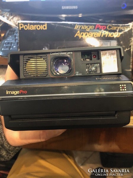 Polaroid image pro fénylépezőgép eredeti dobozában, könyvével.