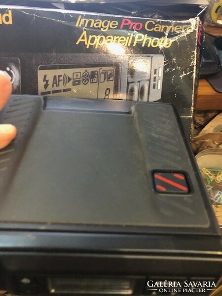 Polaroid image pro camera in original box with book.