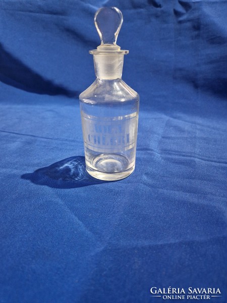 Glass stoppered pharmacy bottle with Aqua Chlori inscription