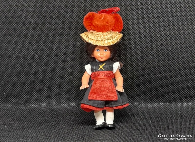 Retro doll house rubber doll in folk costume