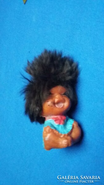 Old laughing big haired tiny rubber doll pencil tip