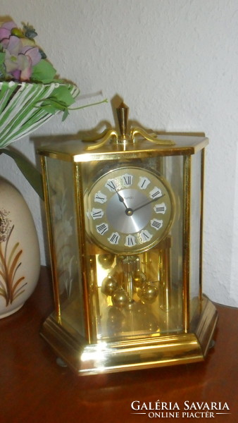 German, kundo brass, flowered glass plate, rotating pendulum, battery-powered fireplace clock.