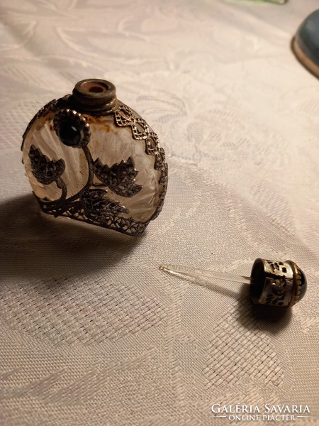 Antique perfume bottle with metal overlay