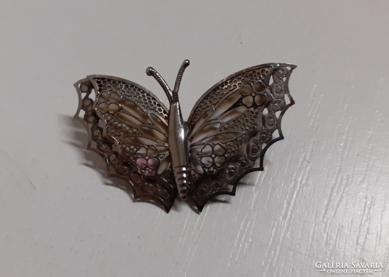 Retro butterfly-shaped brooch with an openwork pattern in good condition