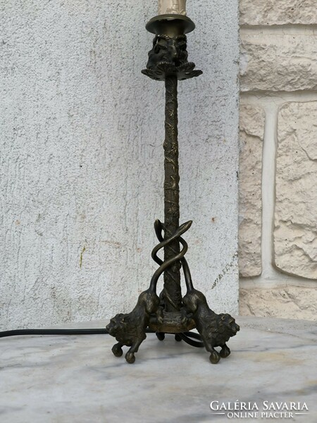 Antique bronze table lamp with lion sculptures. - Candle holder with ram's heads