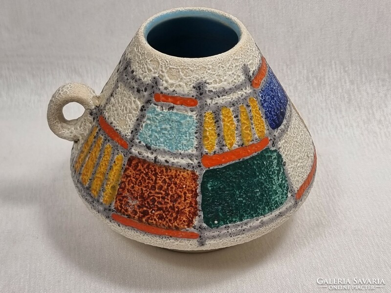 * Ü keramik colored ceramic vase with a small round handle and a rough surface.