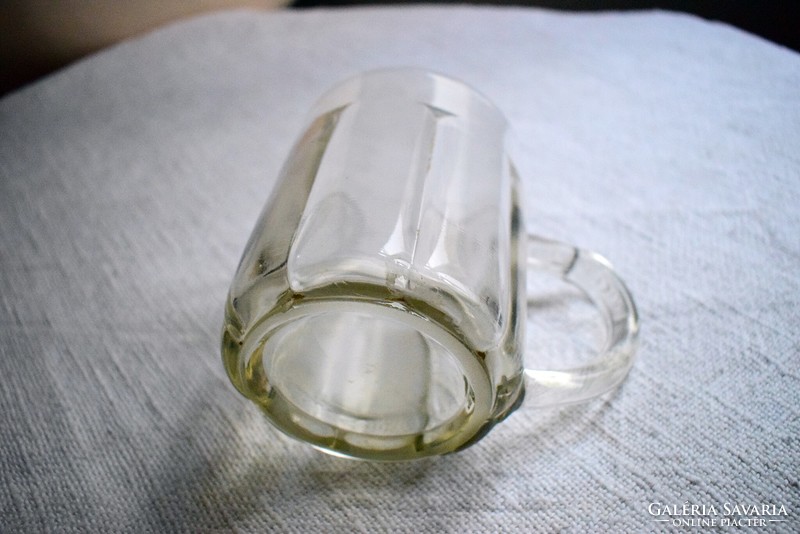 Old glass jug 0.5 liter, polished base, ribbed surface, interesting ear design