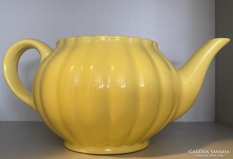 A rare Kispest granite yellow tea jug without a lid, with the accompanying cup.