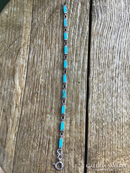 Old silver bracelet with turquoise stones