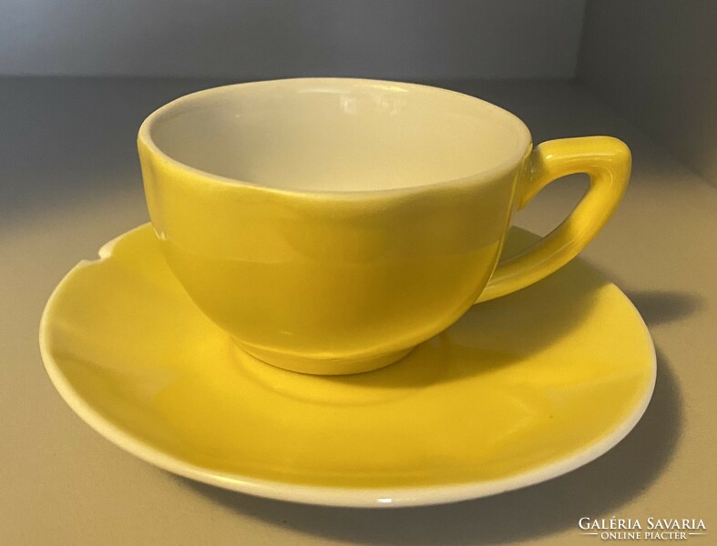Yellow zsolnay cup and saucer.