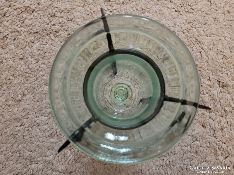 Old glass candle holder with wrought iron holder.