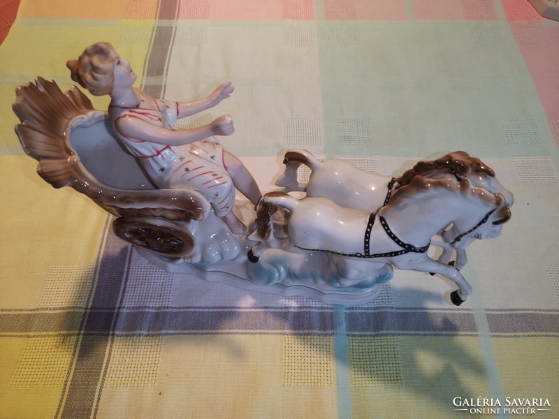 Porcelain lady with horse's teeth and carriage regal crown