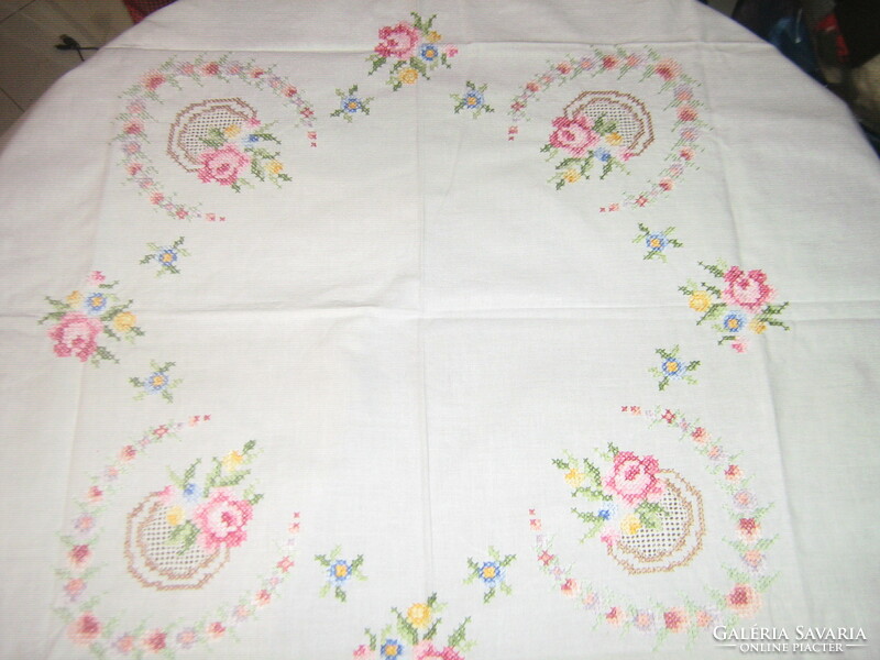 A beautiful rosy tablecloth with a beautiful cross-stitch