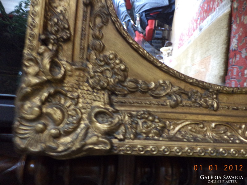 Polished mirror, in a baroque frame.