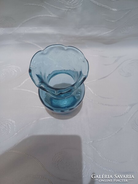 Blue glass vase with ruffled edges