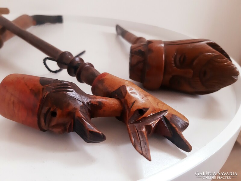 Old carved wooden pipes in a pack