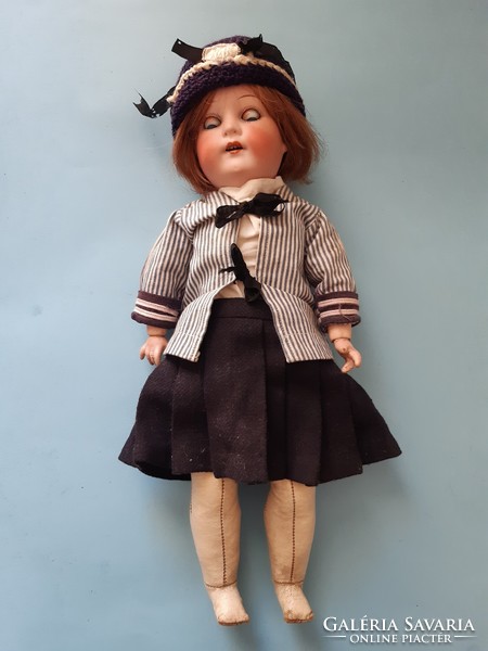 Old antique porcelain head doll with glove leather body, in good condition approx. 35 Cm