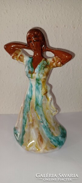 Glazed, fired clay dancing women. Two darts, in different colors n