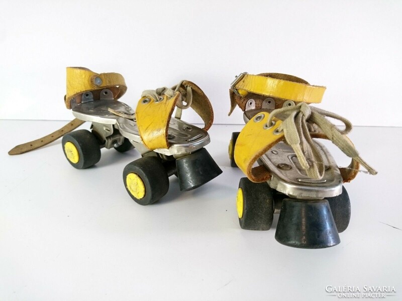 Old retro adjustable size roller skates with leather straps - tuv rheinland germany 1980s